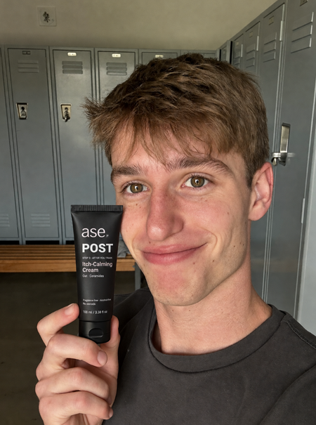 Ryan holding his ASE skincare tube