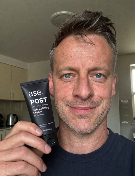 Steve holding his ASE skincare tube