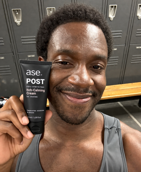 Daniel holding his ASE skincare tube