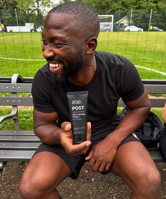 Marcus holding his ASE skincare tube