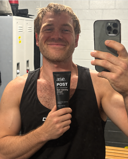 Tom holding his ASE skincare tube